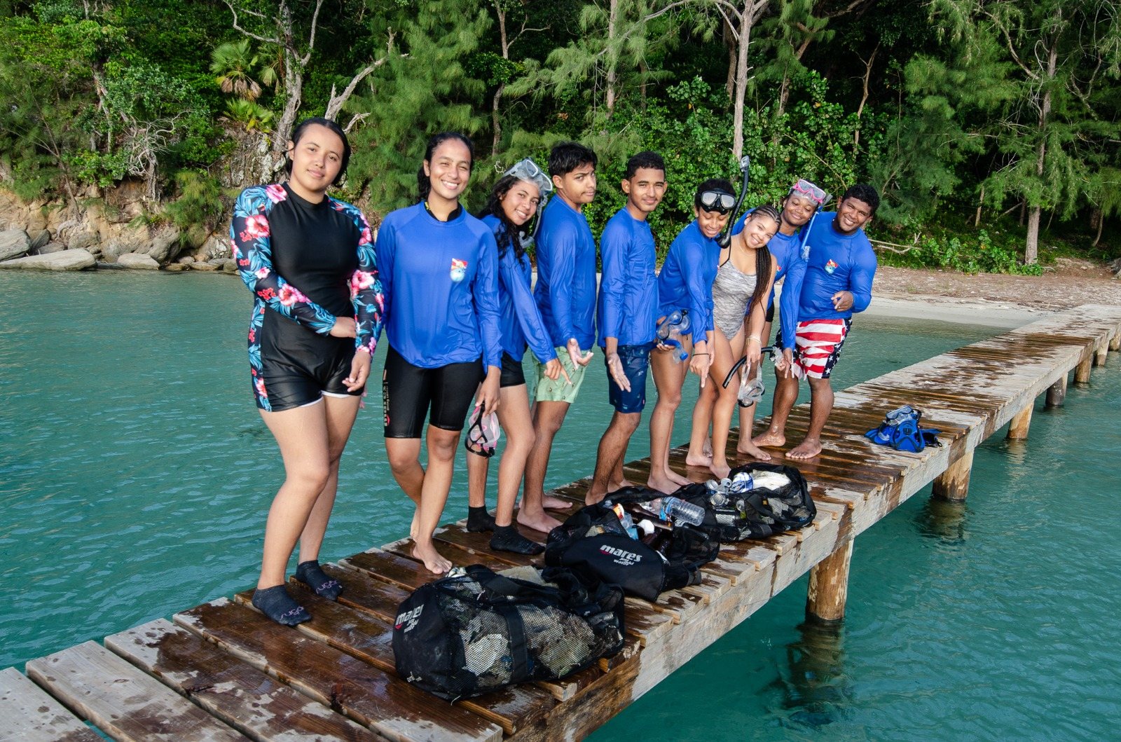 Excursion team gathered on a dock