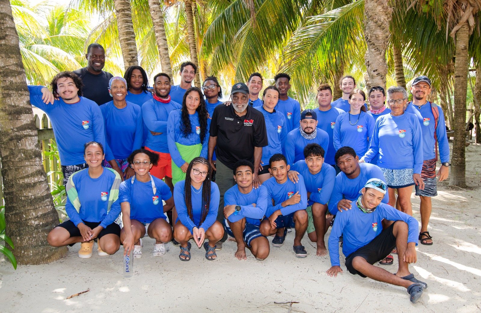 Youth program participants in DTI CARES shirts